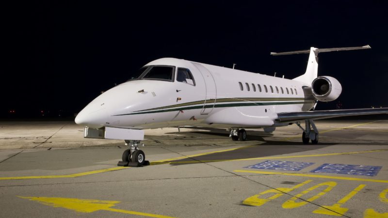 28581307 - small jet plane parked at night